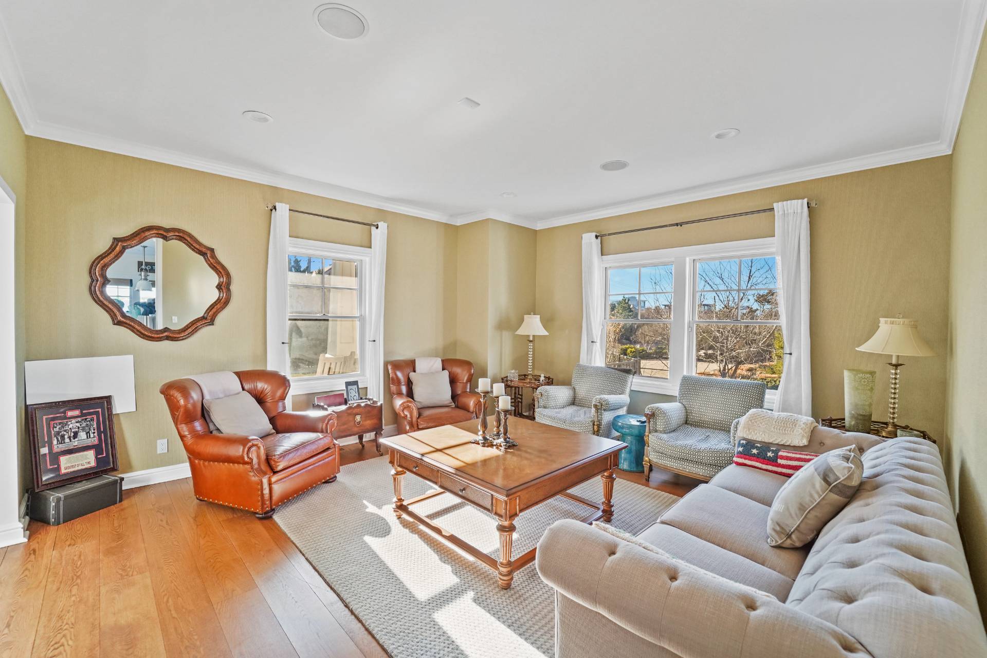 Undisclosed Address Westhampton, NY 11978 - Photo 9 of 22 a living room with furniture a large window and a clock