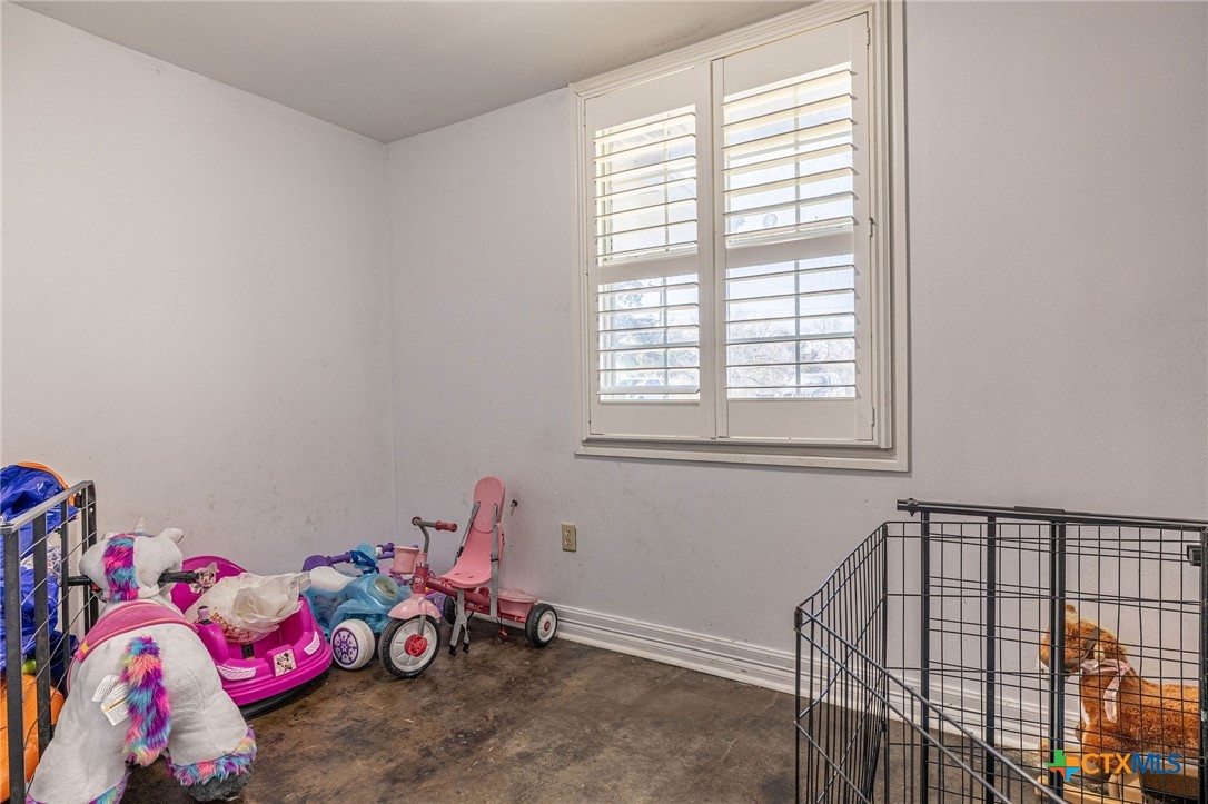 743 Royal Road Port Lavaca, TX 77979 - Photo 12 of 21 a bedroom with a bed and a window