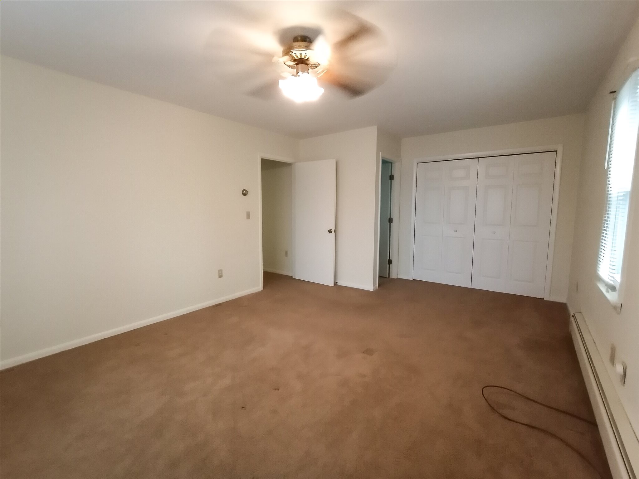 619 Miller Farm Road Staunton, VA 24401 - Photo 20 of 40 an empty room with windows and fan