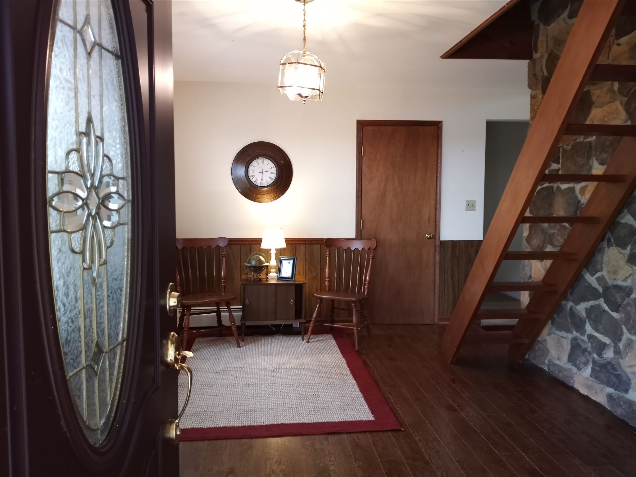619 Miller Farm Road Staunton, VA 24401 - Photo 5 of 40 a view of a hallway with wooden floor and stairs