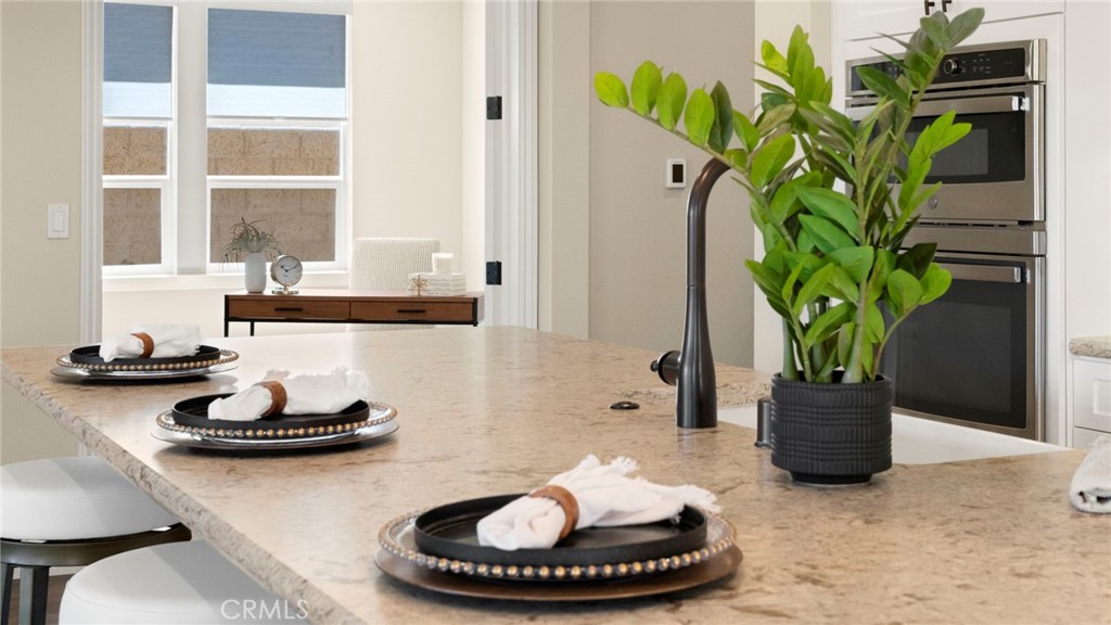 867 Trail View Place Nipomo, CA 93444 - Photo 12 of 71 a vase of flowers sitting on a dining table