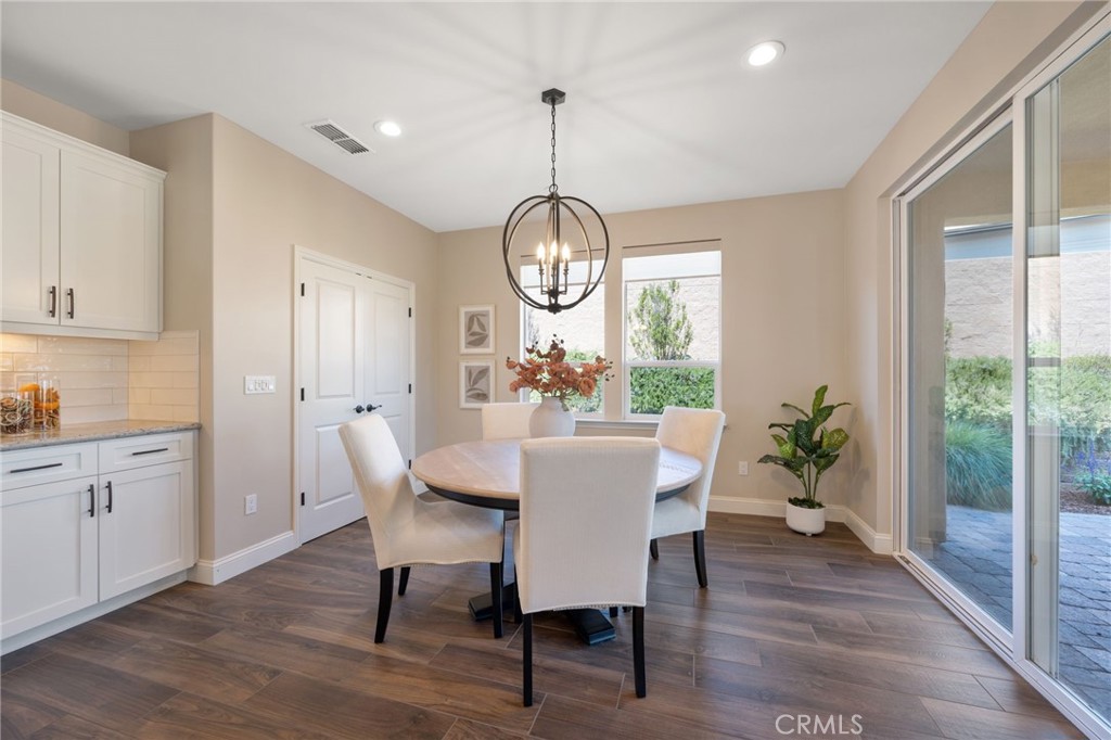 867 Trail View Place Nipomo, CA 93444 - Photo 19 of 71 a view of a dining room with furniture window and wooden floor