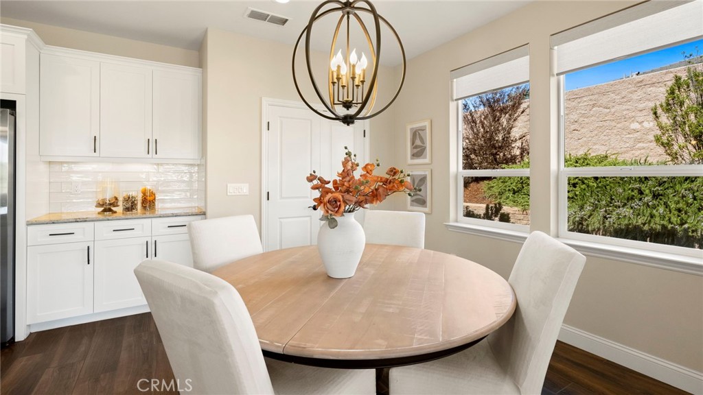 867 Trail View Place Nipomo, CA 93444 - Photo 21 of 71 a dining room with furniture and a mirror