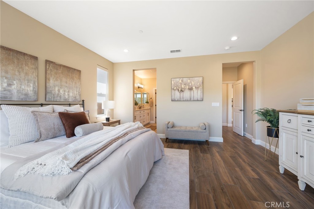 867 Trail View Place Nipomo, CA 93444 - Photo 28 of 71 a spacious bedroom with a bed and a couch