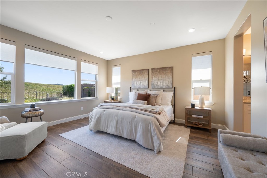 867 Trail View Place Nipomo, CA 93444 - Photo 29 of 71 a spacious bedroom with a large bed and a large window