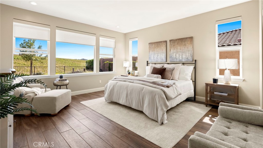 867 Trail View Place Nipomo, CA 93444 - Photo 31 of 71 a bedroom with a large bed couch and a large window