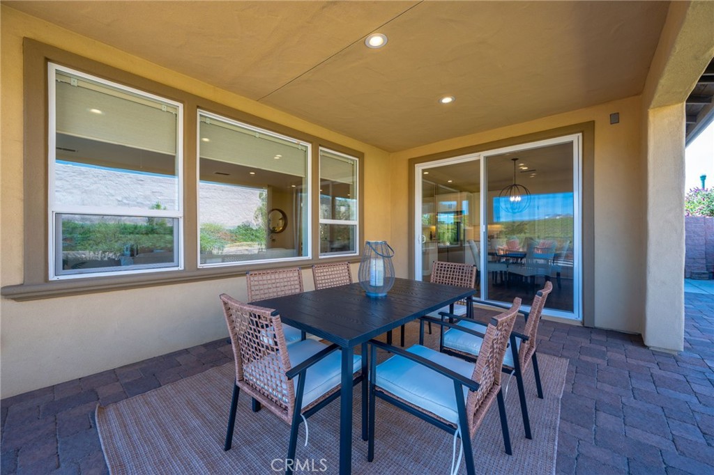 867 Trail View Place Nipomo, CA 93444 - Photo 46 of 71 a view of a dining room with furniture and wooden floor