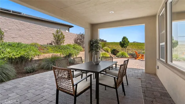 swimming pool view with a seating space