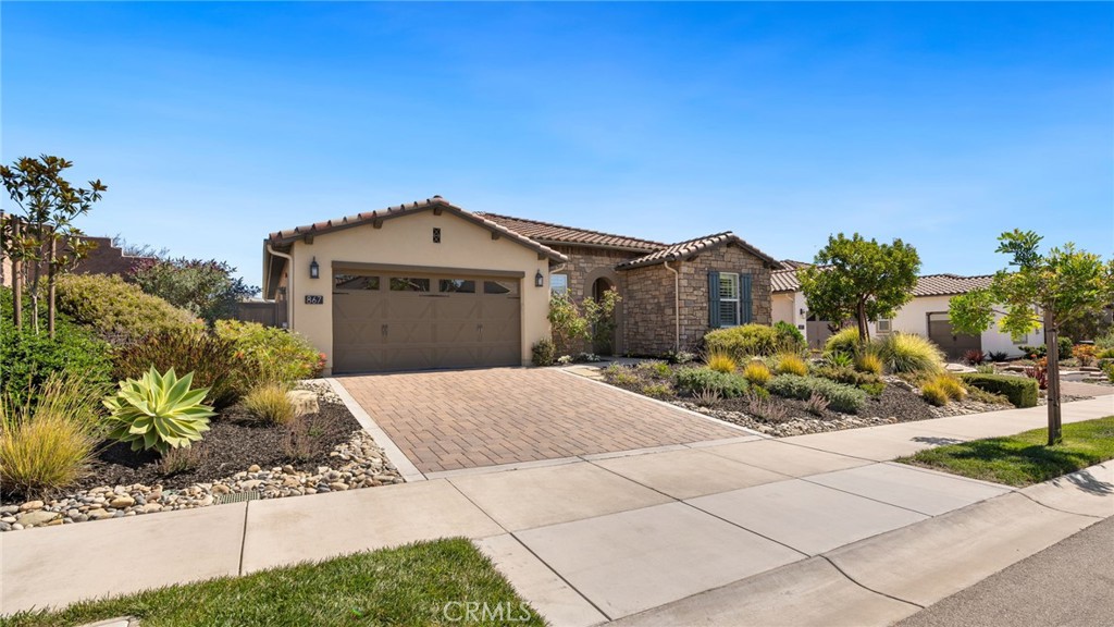867 Trail View Place Nipomo, CA 93444 - Photo 59 of 71 a front view of a house with a garden