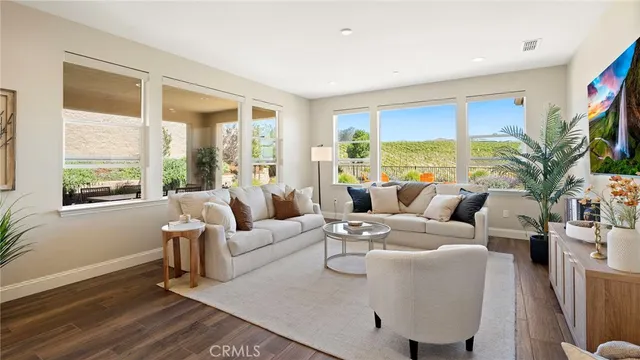 a living room with fireplace furniture and a flat screen tv