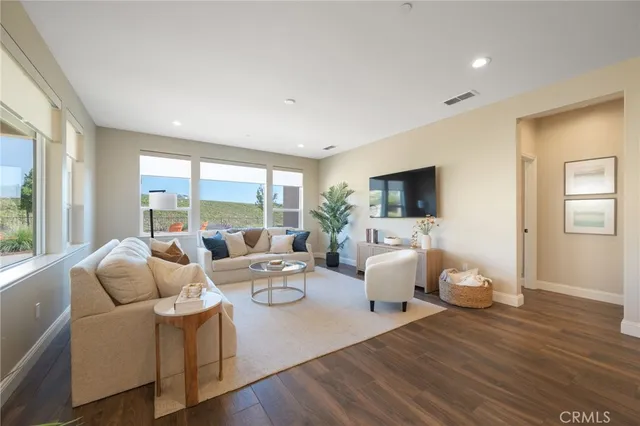 a living room with furniture and a table
