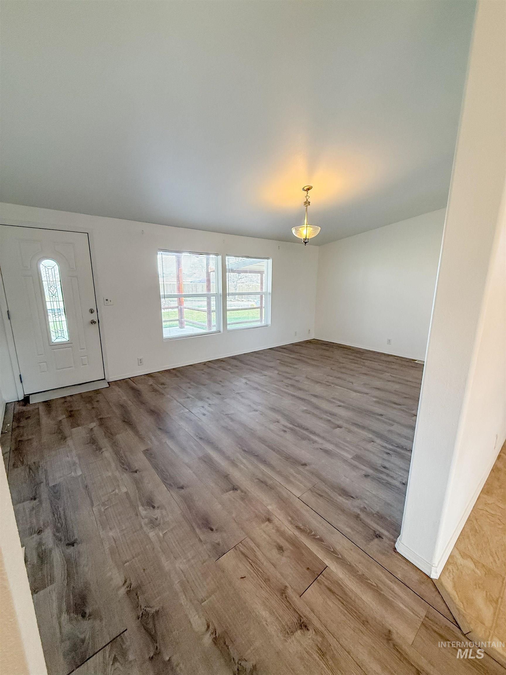 11205 Dally Lane Middleton, ID 83644 - Photo 2 of 39 Living room with self leveling LVP flooring.