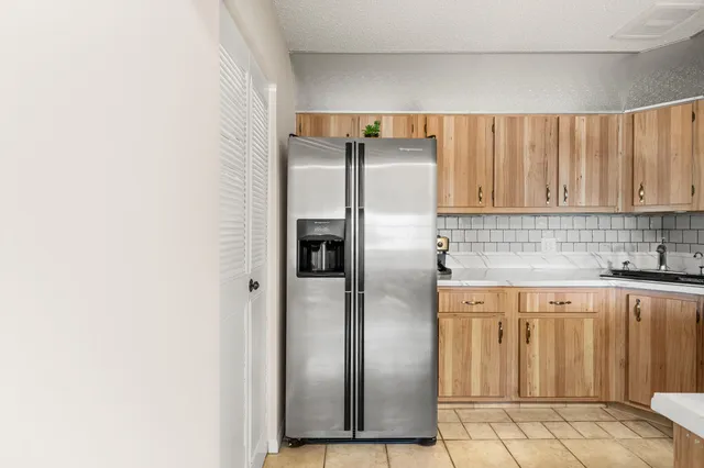 a kitchen with stainless steel appliances a stove a sink and a microwave