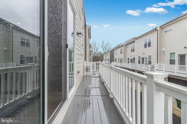 a view of a balcony with wooden floor
