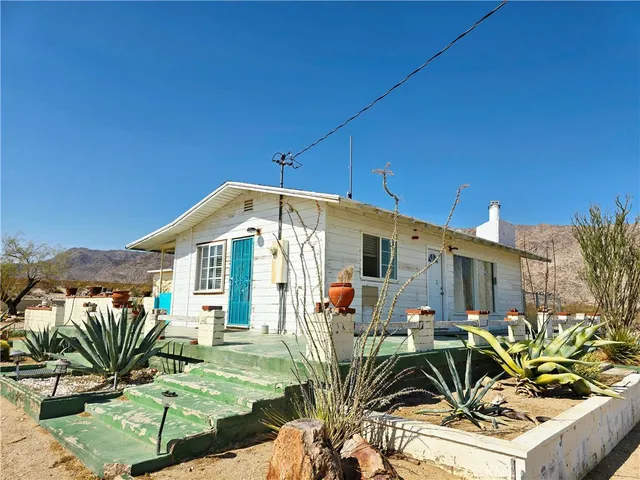 a view of a snow in the distance in a field