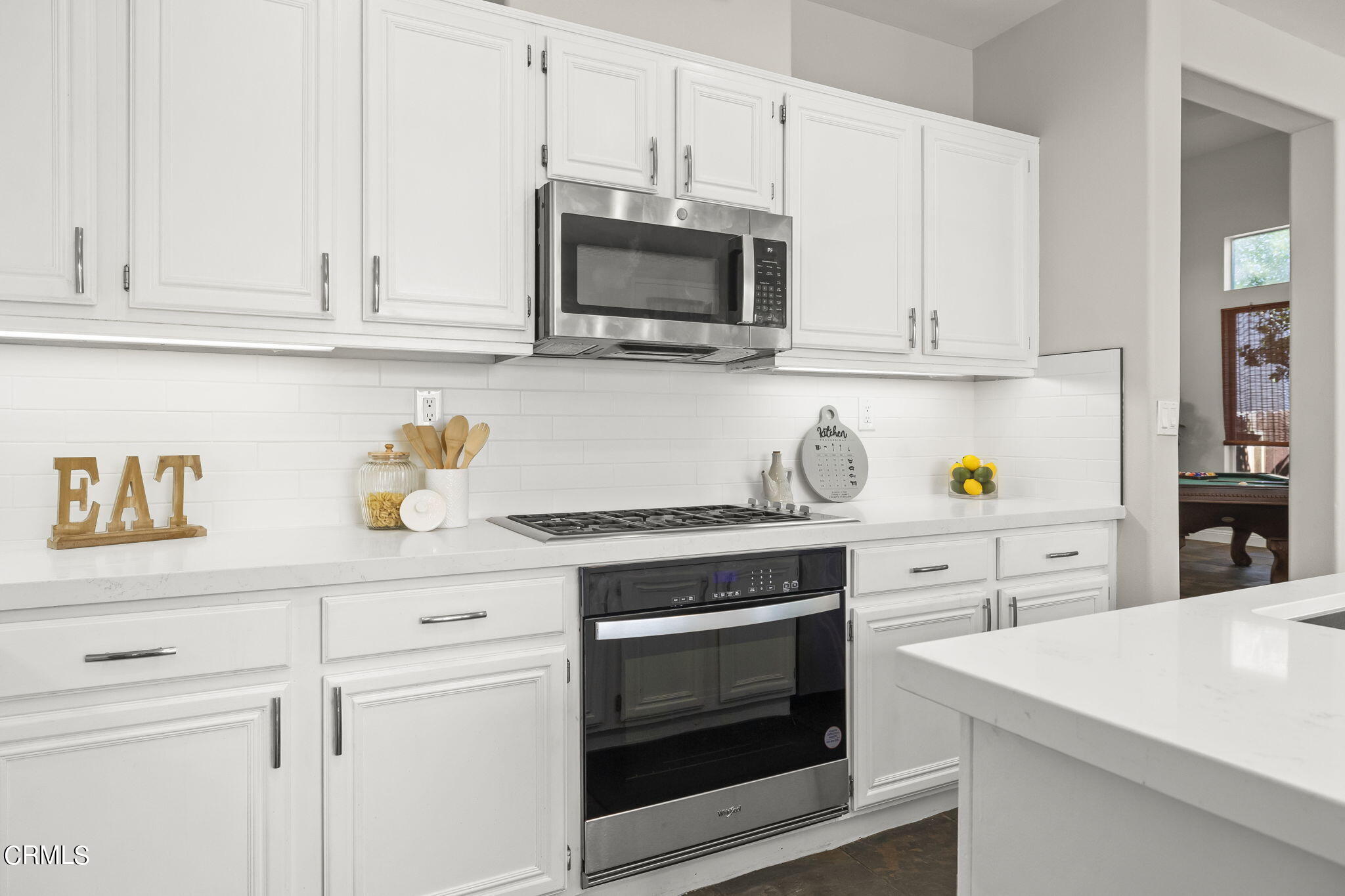 4654 Via Dulce Camarillo, CA 93012 - Photo 19 of 51 a kitchen with white cabinets and appliances