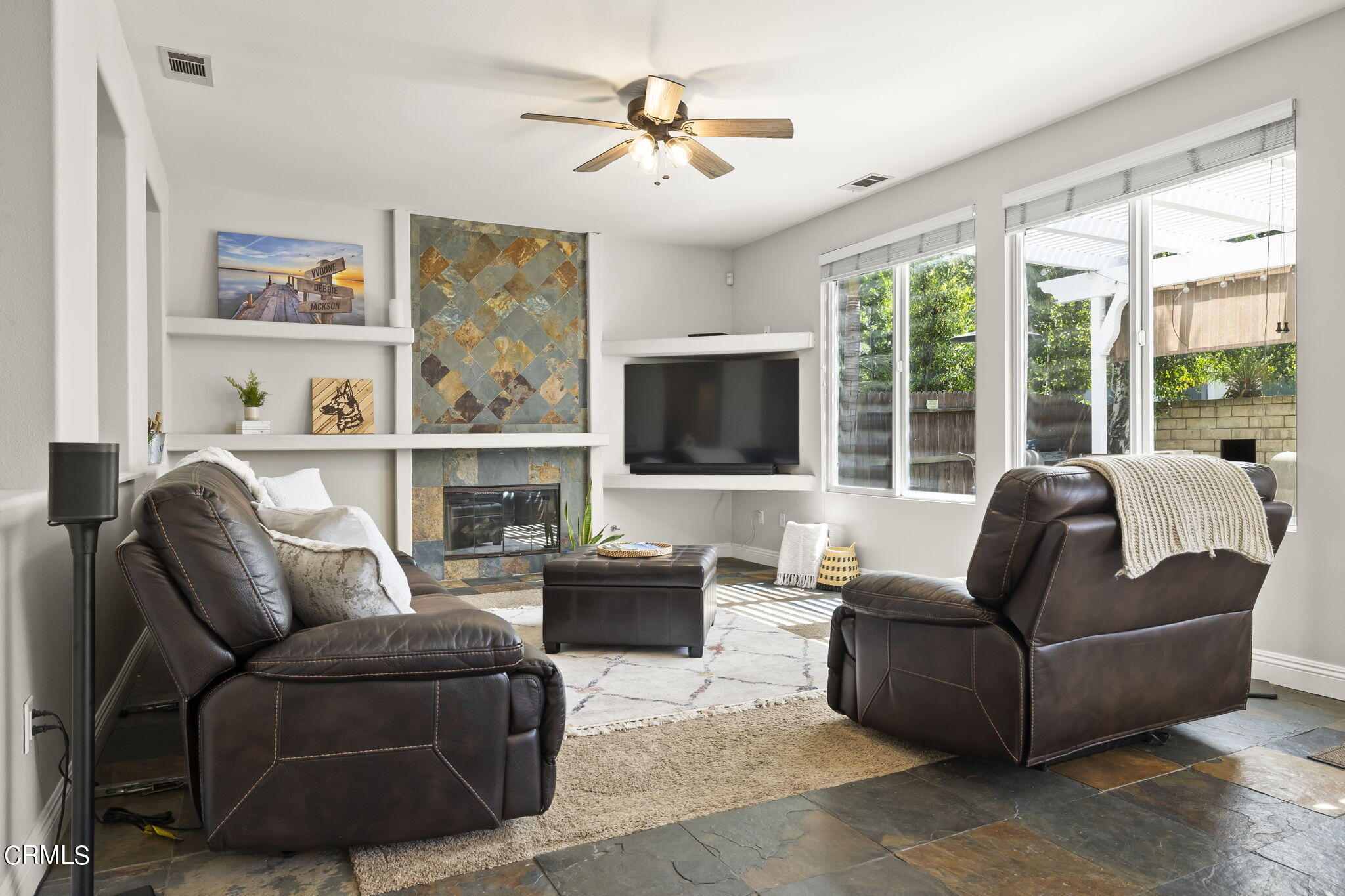 4654 Via Dulce Camarillo, CA 93012 - Photo 22 of 51 a living room with furniture a flat screen tv and a large window