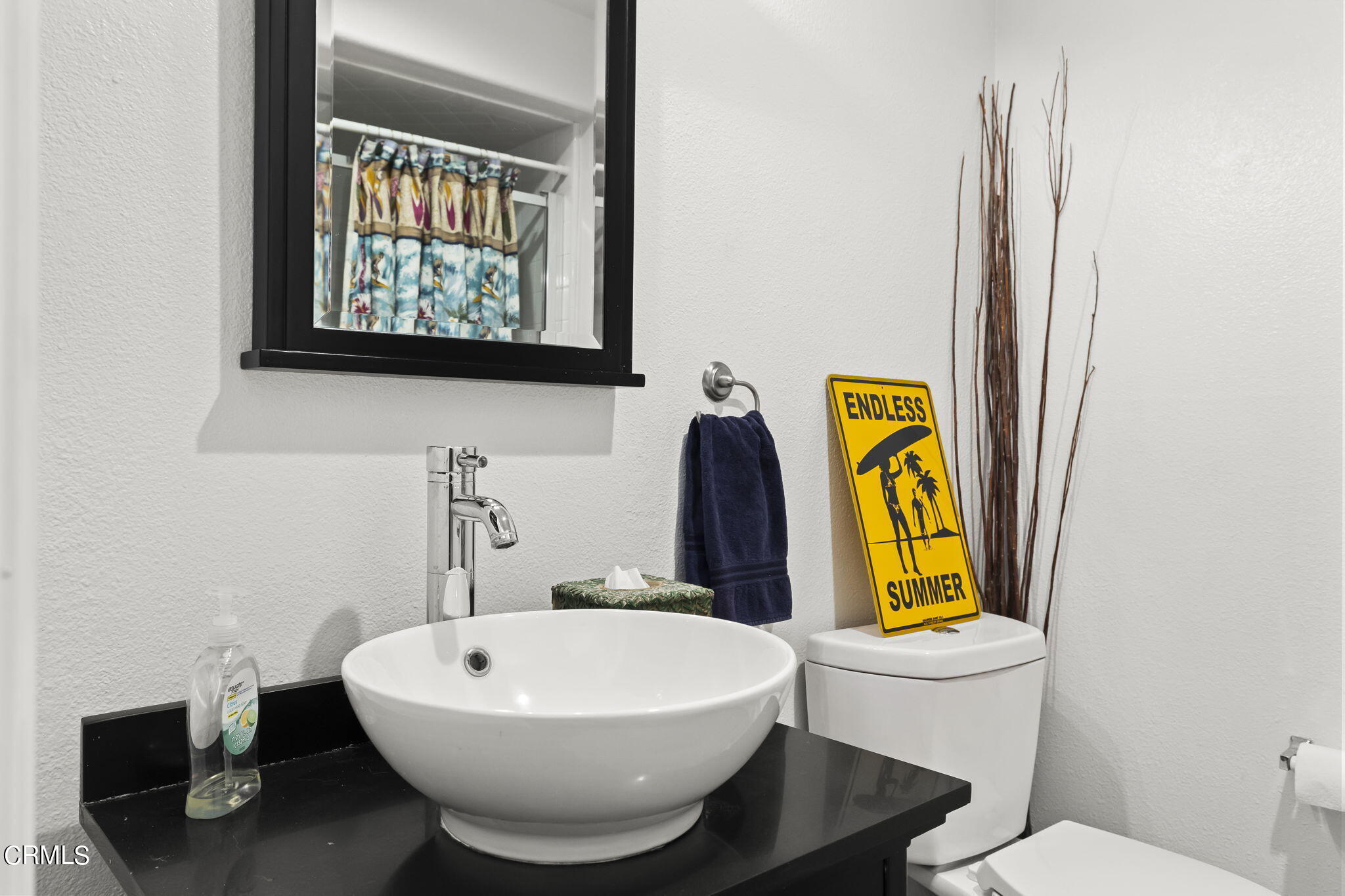 4654 Via Dulce Camarillo, CA 93012 - Photo 26 of 51 a bathroom with a toilet sink and mirror