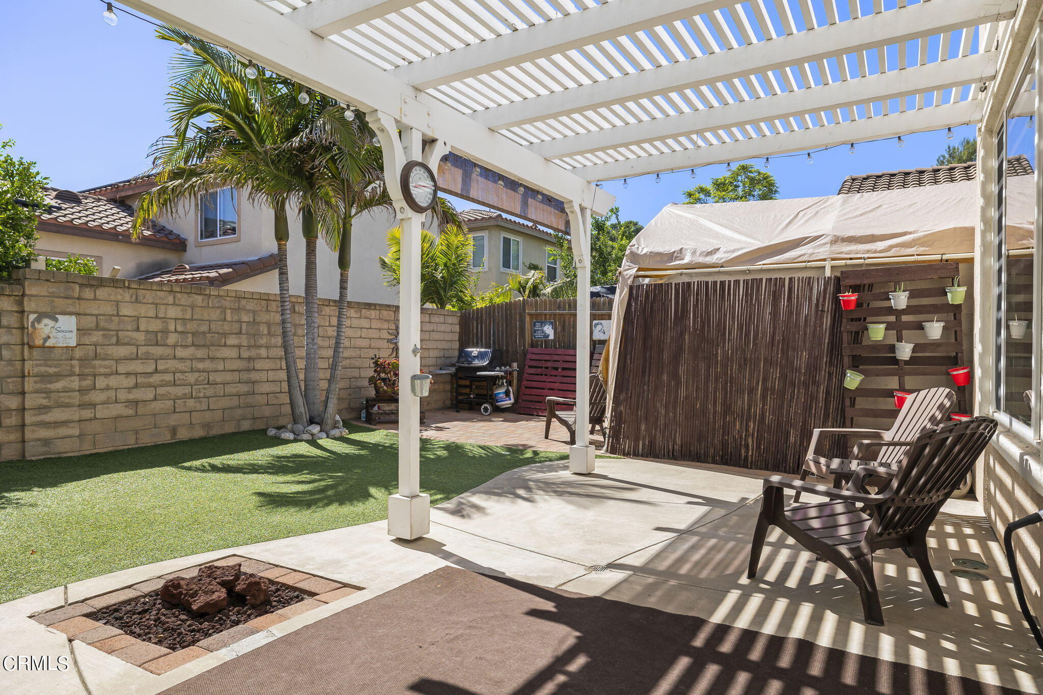 4654 Via Dulce Camarillo, CA 93012 - Photo 32 of 51 a patio with table and chairs and potted plants