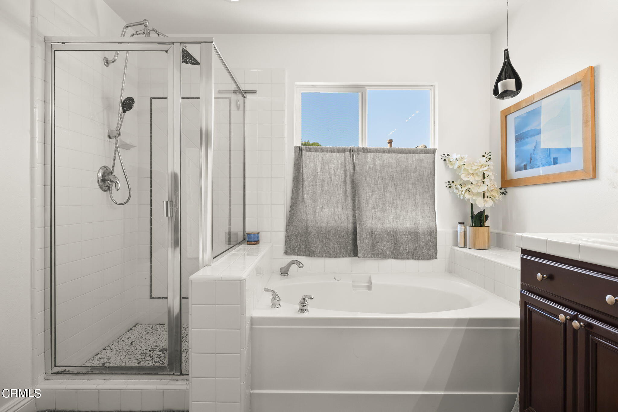 4654 Via Dulce Camarillo, CA 93012 - Photo 40 of 51 a bathroom with a bathtub and a shower