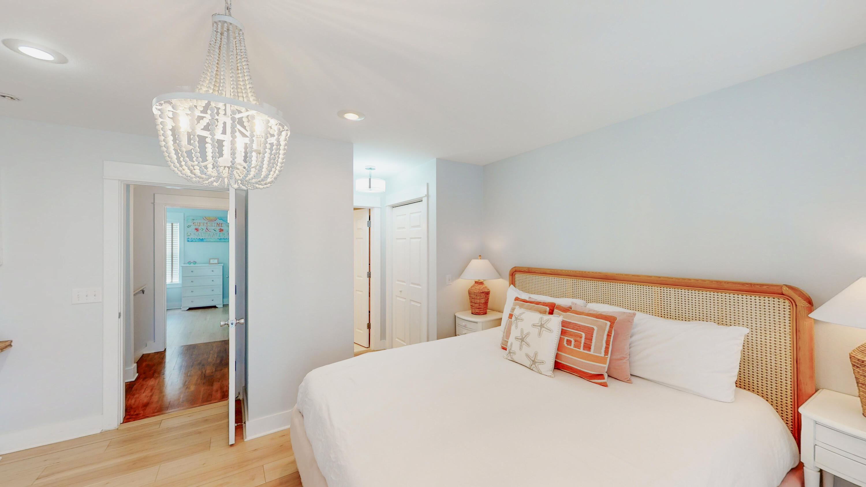 249 Beach Bike Way Inlet Beach, FL 32461 - Photo 21 of 38 a bedroom with a bed and a chandelier
