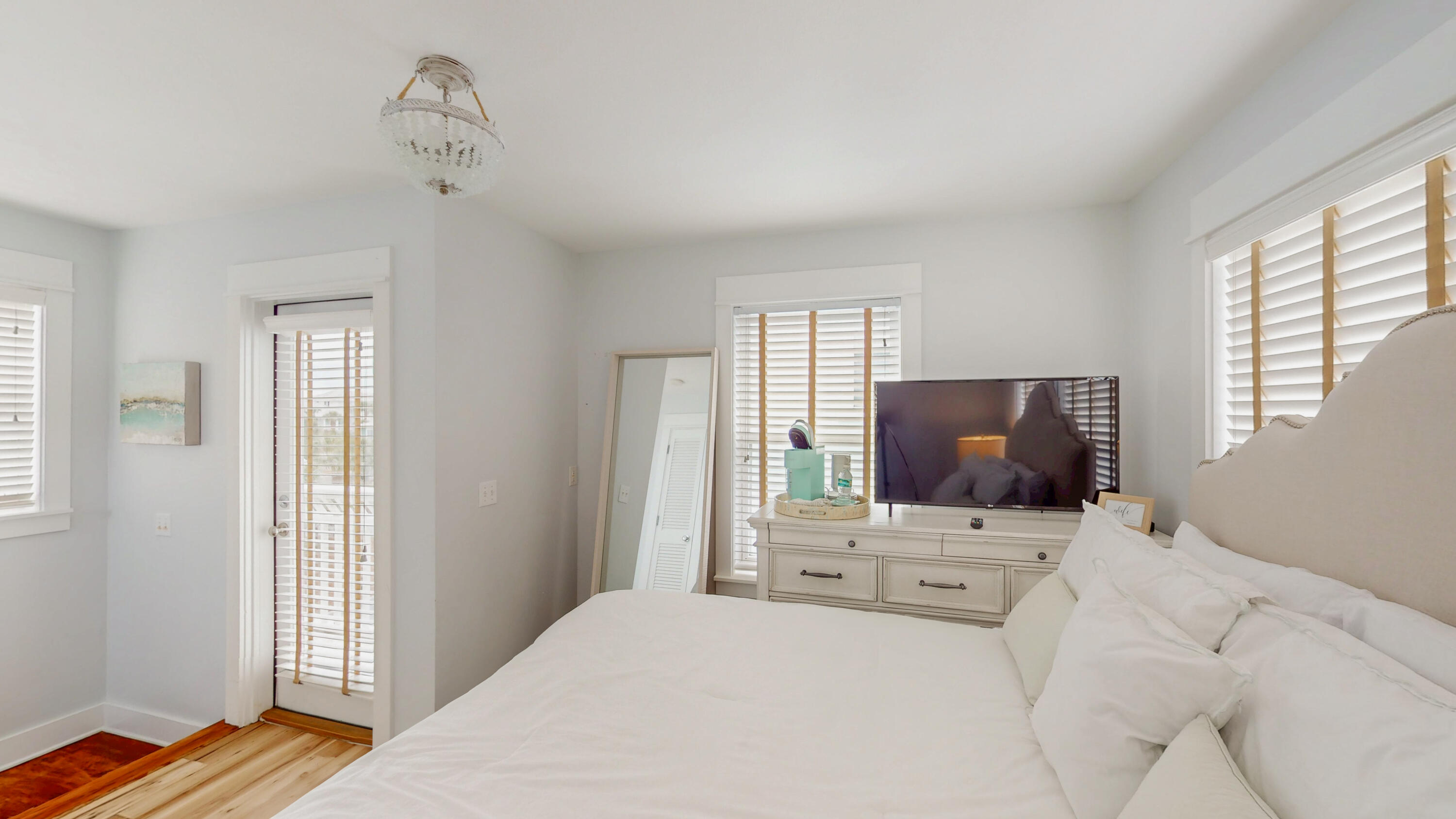 249 Beach Bike Way Inlet Beach, FL 32461 - Photo 29 of 38 a bedroom with a bed and flat tv screen on the dresser
