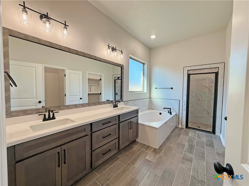 4433 Agave Trail Temple, TX 76502 - Photo 21 of 27 a spacious bathroom with a double vanity sink mirror and double