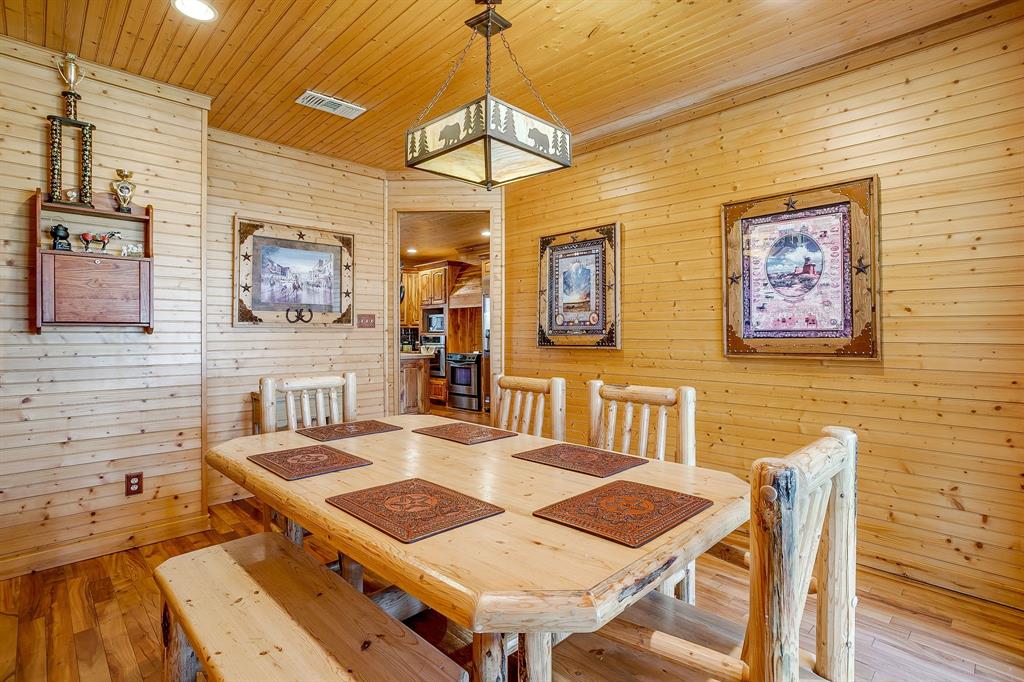 1791 Farm To Market Road 730 North Decatur, TX 76234 - Photo 20 of 40 a view of a dining room with furniture a chandelier and wooden floor