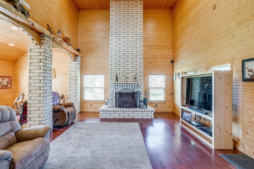 1791 Farm To Market Road 730 North Decatur, TX 76234 - Photo 23 of 40 a living room with furniture and a fireplace