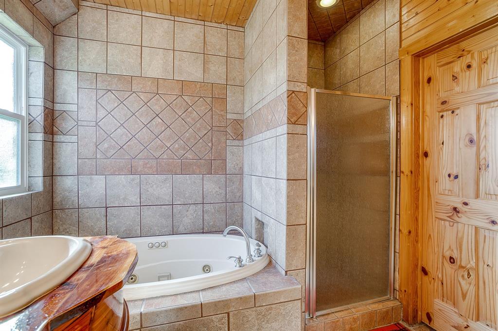 1791 Farm To Market Road 730 North Decatur, TX 76234 - Photo 27 of 40 a bathroom with a tub and shower