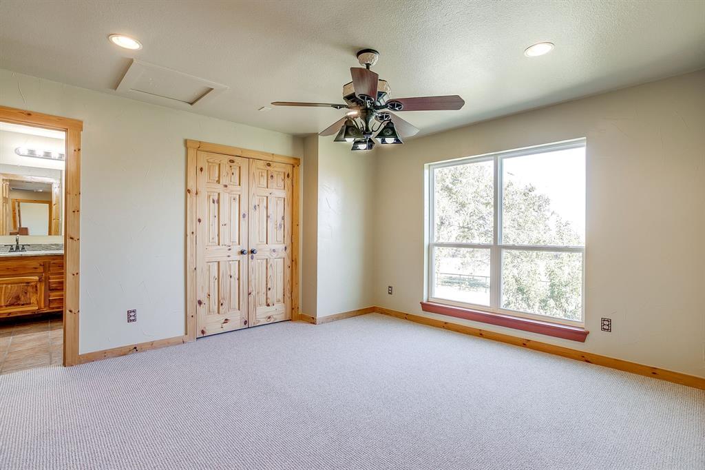 1791 Farm To Market Road 730 North Decatur, TX 76234 - Photo 33 of 40 an empty room with windows and fan