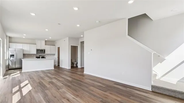 a kitchen with a sink and a refrigerator