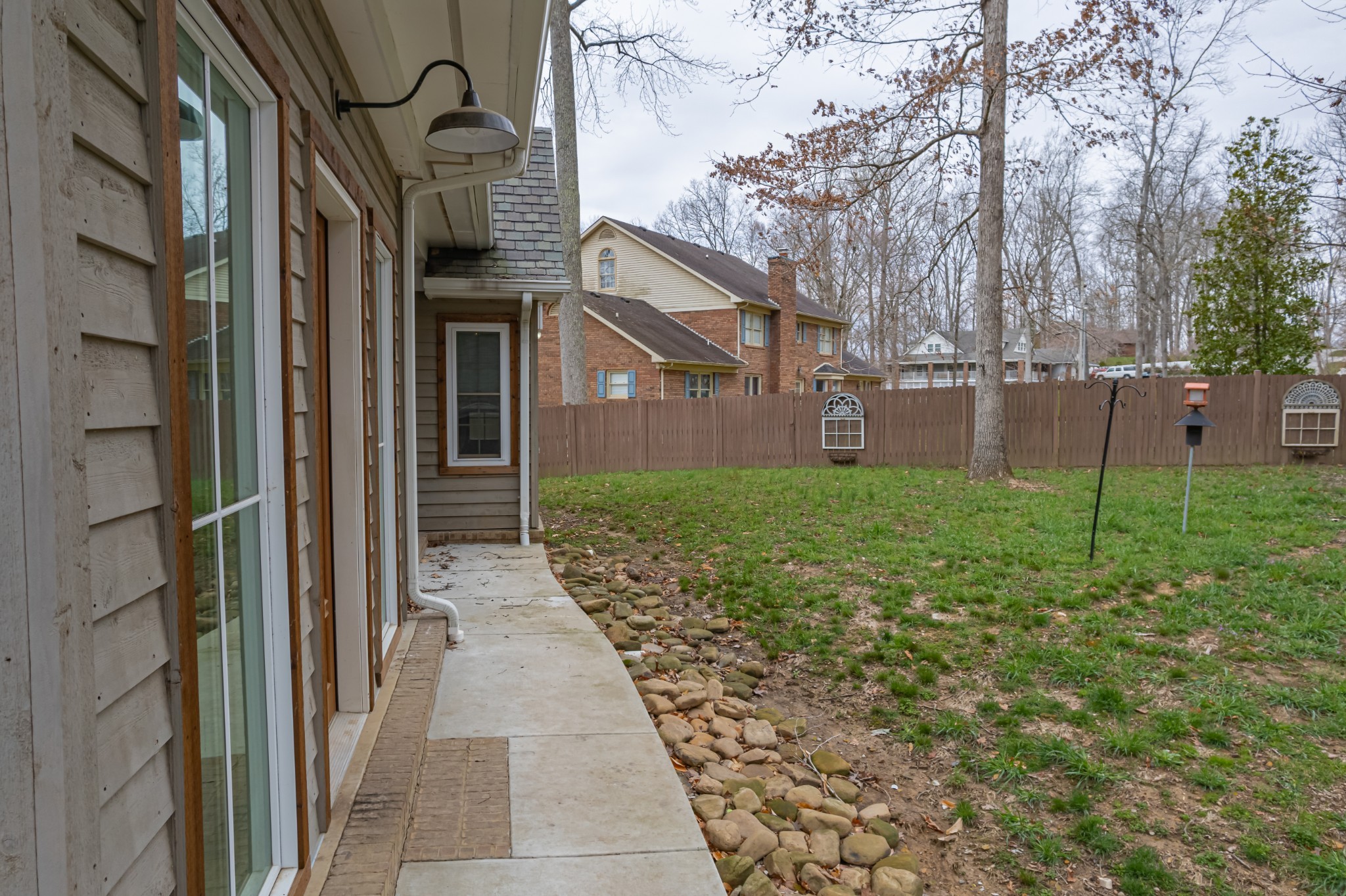 550 Laurel Crown Road Manchester, TN 37355 - Photo 9 of 87 a view of a brick house with many windows next to a yard