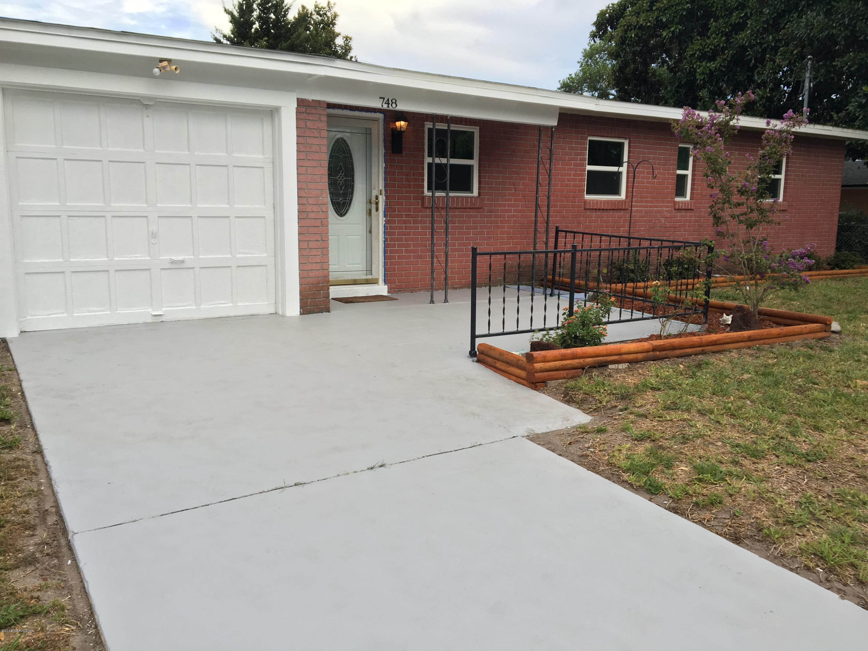 748 Vecuna Road Atlantic Beach, FL 32233 - Photo 1 of 33 a view of a house with backyard and sitting area