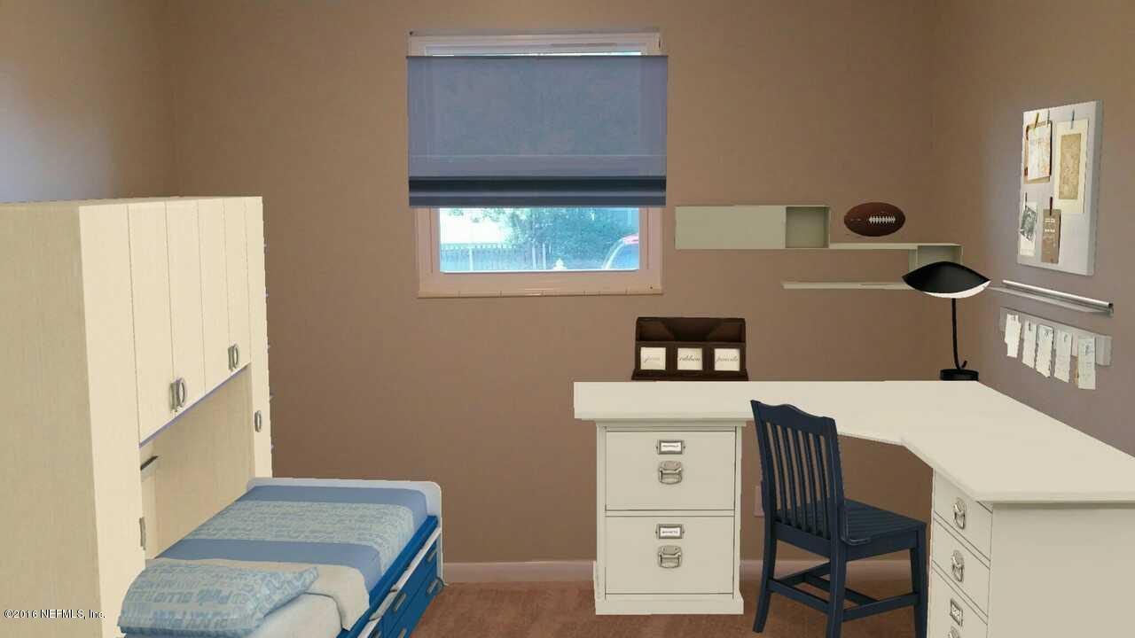 748 Vecuna Road Atlantic Beach, FL 32233 - Photo 15 of 33 a bedroom with a bed and a window