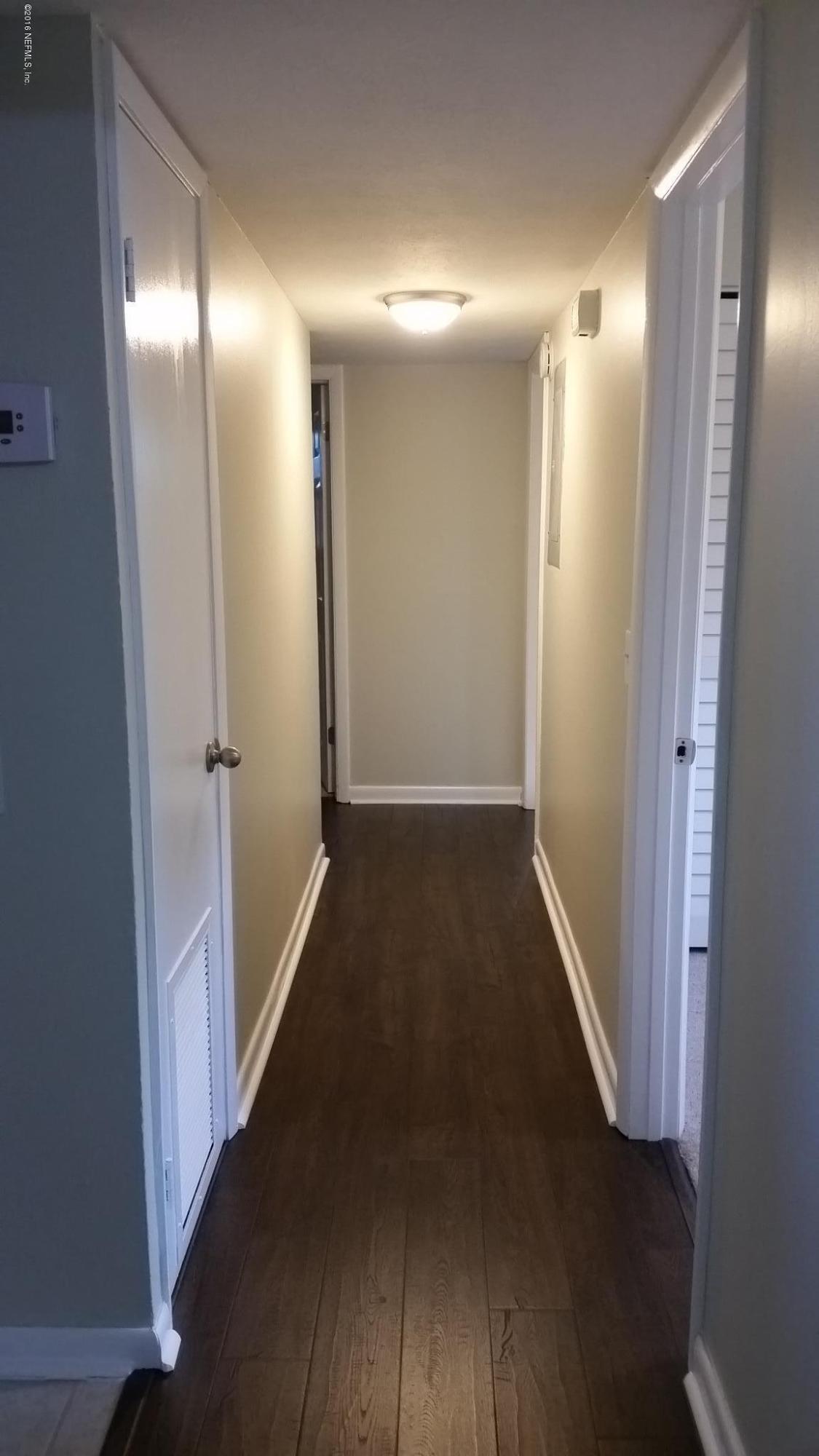 748 Vecuna Road Atlantic Beach, FL 32233 - Photo 24 of 33 a view of hallway with wooden floor
