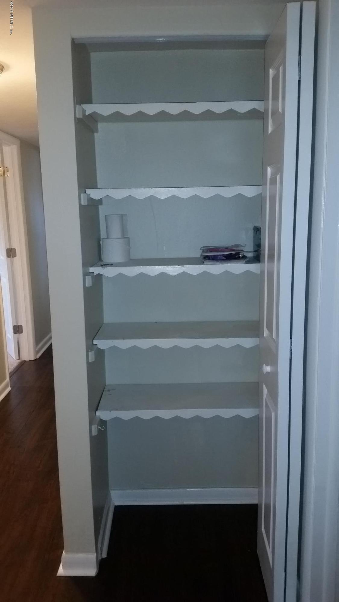 748 Vecuna Road Atlantic Beach, FL 32233 - Photo 25 of 33 a view of walk in closet with empty racks