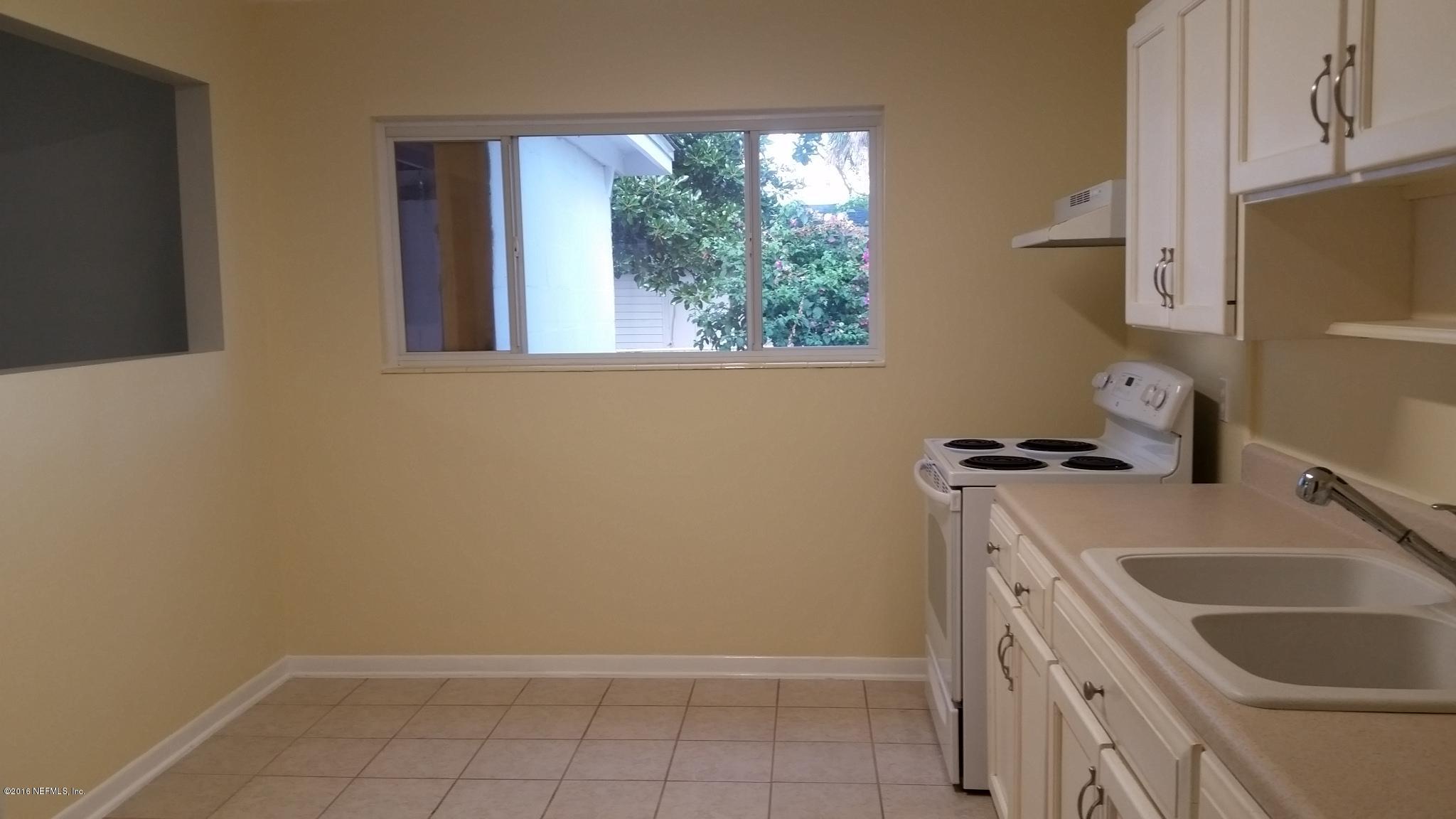 748 Vecuna Road Atlantic Beach, FL 32233 - Photo 7 of 33 a room with a sink a washer and dryer