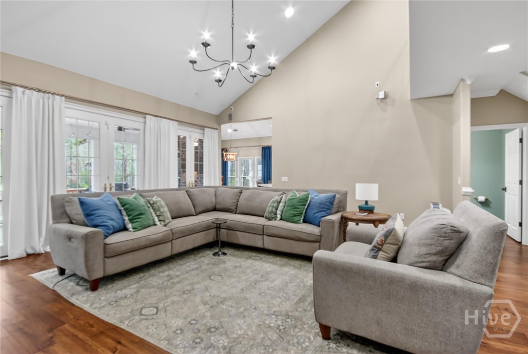 101 Red Bluff Run Rincon, GA 31326 - Photo 11 of 45 Large living room with oversized chandelier