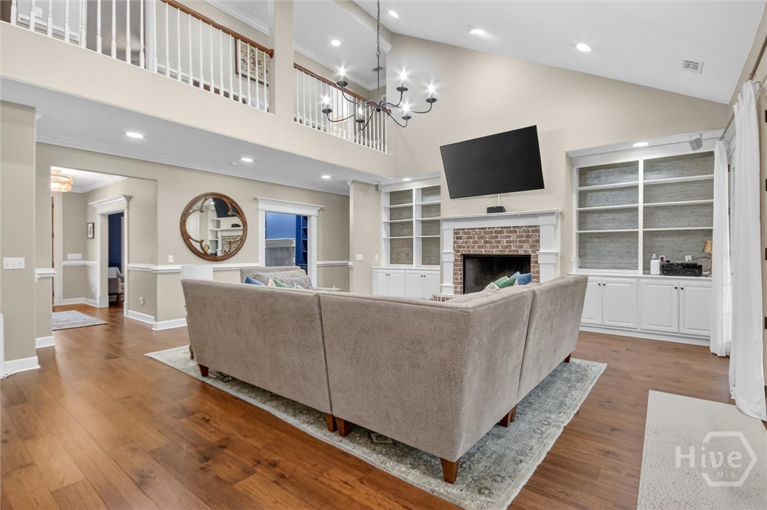 101 Red Bluff Run Rincon, GA 31326 - Photo 12 of 45 Living room with foyer to the right and upstairs open spinal balusters and railing