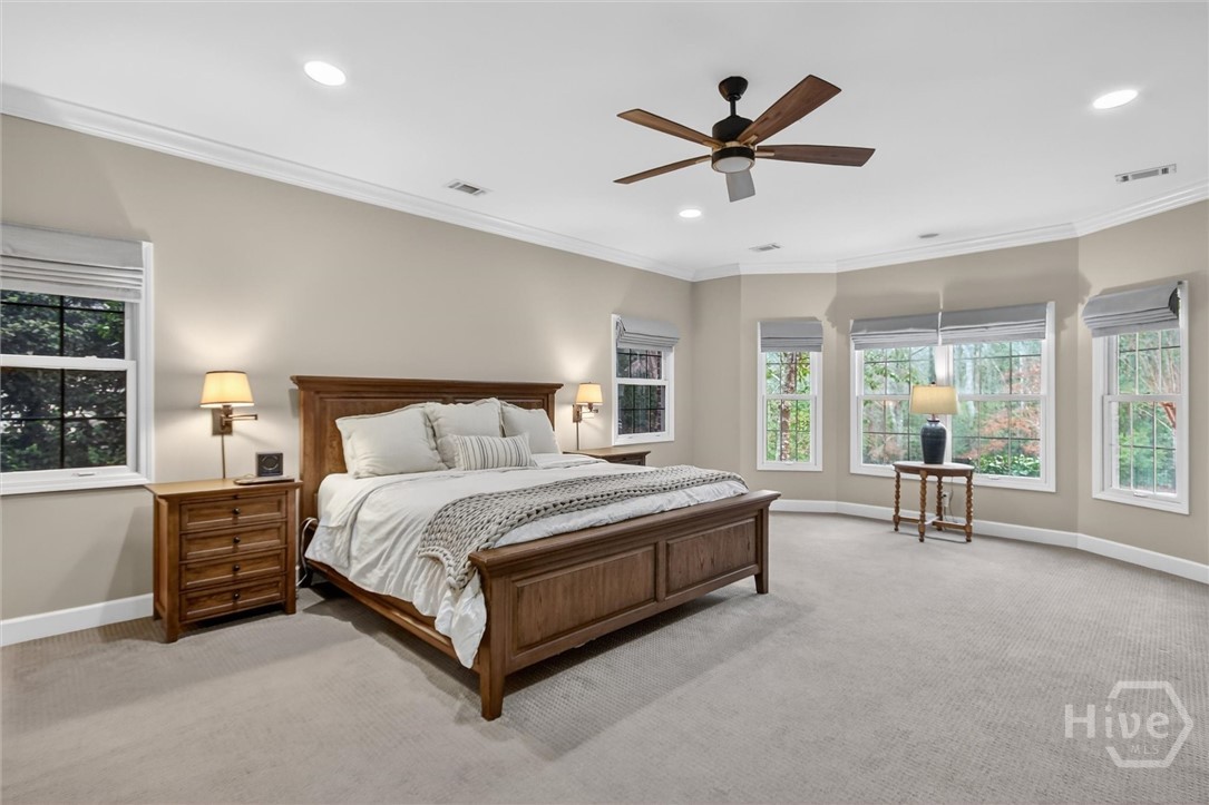 101 Red Bluff Run Rincon, GA 31326 - Photo 22 of 45 Primary bedroom on main floor, window tinting on side windows for added efficiency and privacy