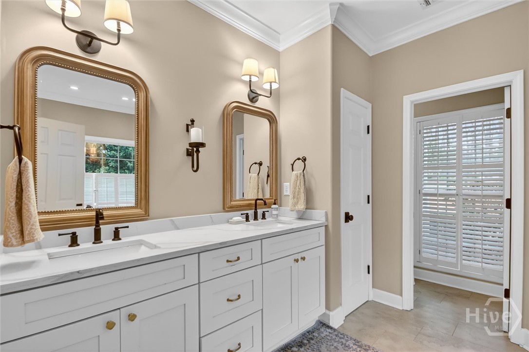 101 Red Bluff Run Rincon, GA 31326 - Photo 24 of 45 Dual vanities with quarts counter tops and travertine flooring and surround in shower