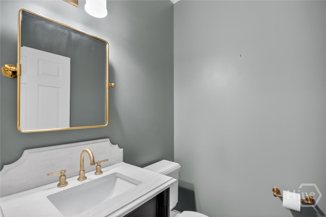 101 Red Bluff Run Rincon, GA 31326 - Photo 28 of 45 1/2 bathroom with custom made cabinetry and carara marble decorative edge finishing