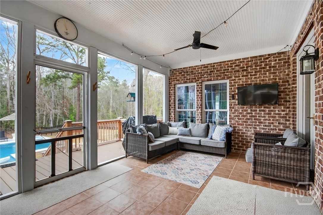 101 Red Bluff Run Rincon, GA 31326 - Photo 40 of 45 Screened porch with tiled flooring and sitting area