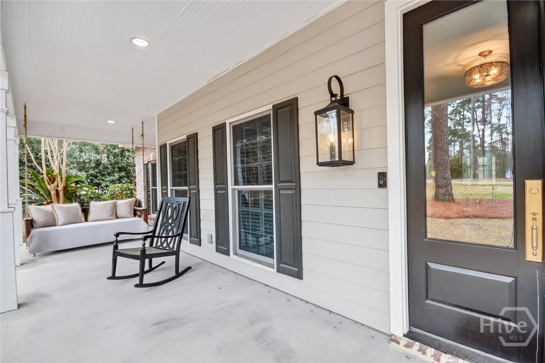 101 Red Bluff Run Rincon, GA 31326 - Photo 6 of 45 Front porch with twin size porch swing