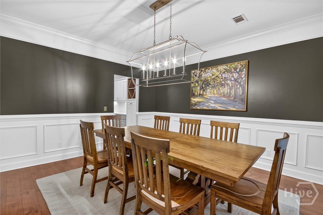 101 Red Bluff Run Rincon, GA 31326 - Photo 10 of 45 Formal dining room with formal chair railing and crown moldings