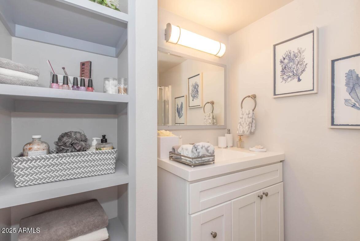 2936 East Indian School Road, Unit ST Phoenix, AZ 85016 - Photo 4 of 11 a bathroom with a sink cabinets and toilet