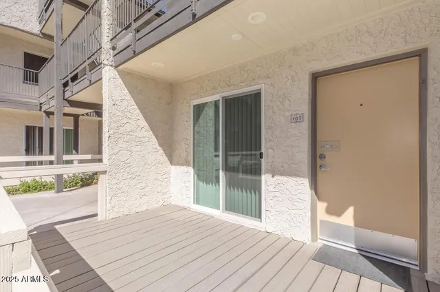 a view of a balcony with wooden floor