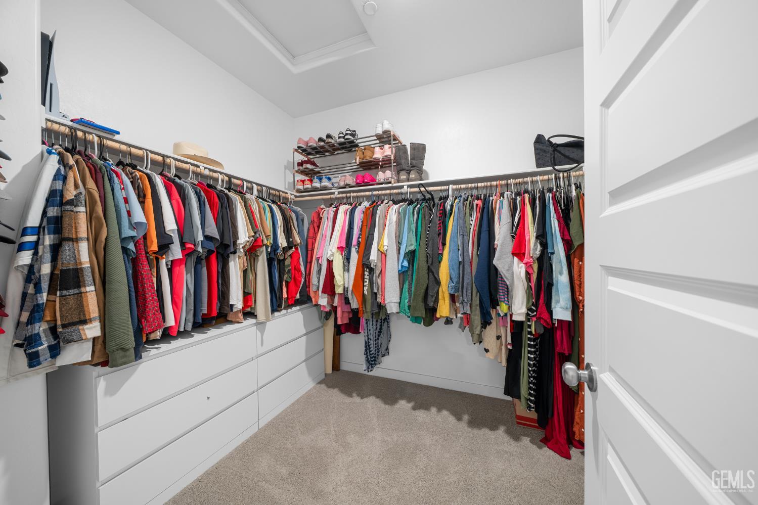 Undisclosed Address Shafter, CA 93263 - Photo 27 of 40 a view of walk in closet with clothes