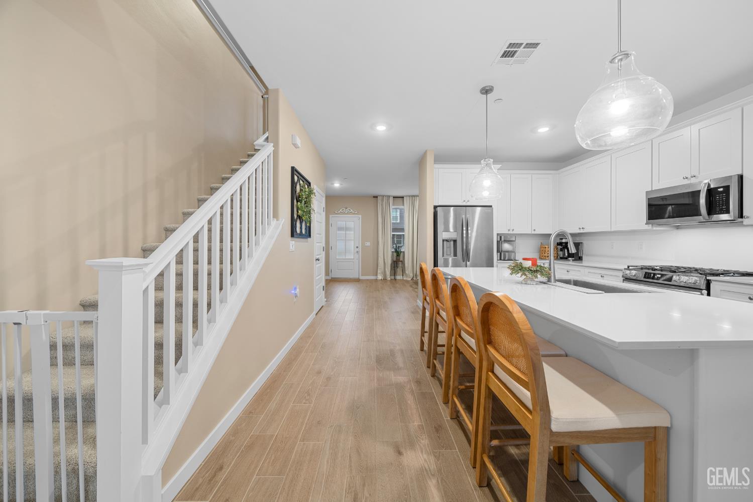 Undisclosed Address Shafter, CA 93263 - Photo 38 of 40 a view of a kitchen with kitchen island wooden floor center island and stainless steel appliances
